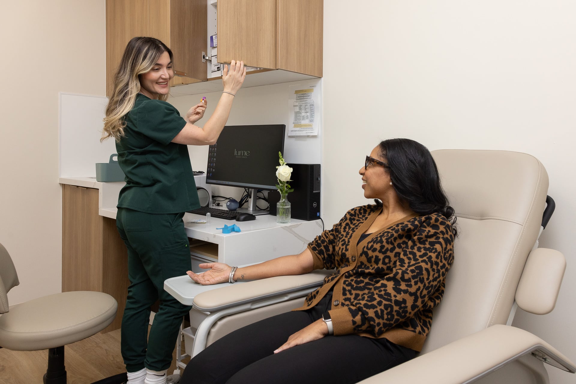 Nurse and patient smiling